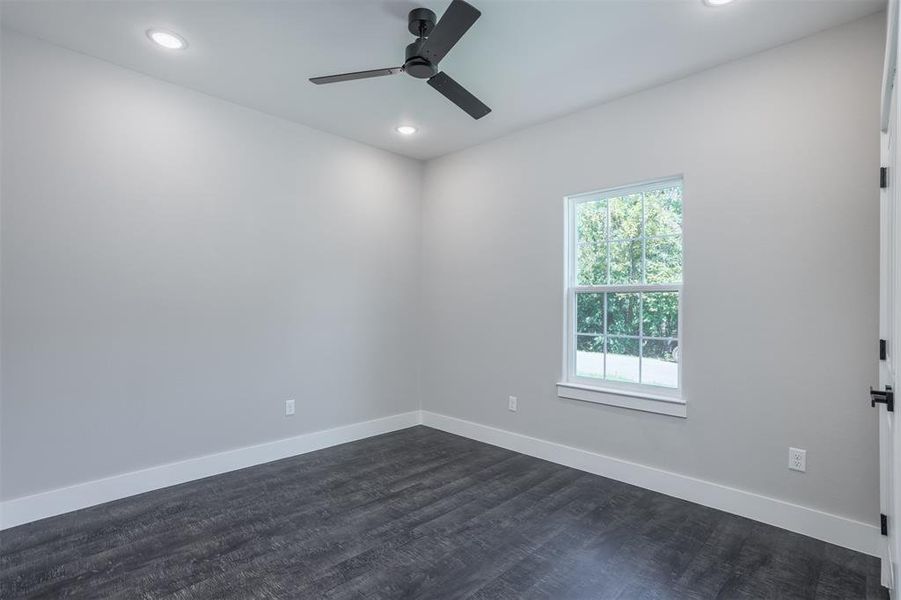 Unfurnished room with dark wood-style flooring, recessed lighting, and ceiling fan Unfurnished room with dark wood-style flooring, recessed lighting, and ceiling fan