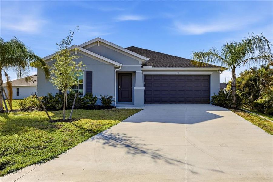 Front exterior of a new home in Rotonda Lakes, Rotonda West, FL, highlighting curb appeal (Image 19).