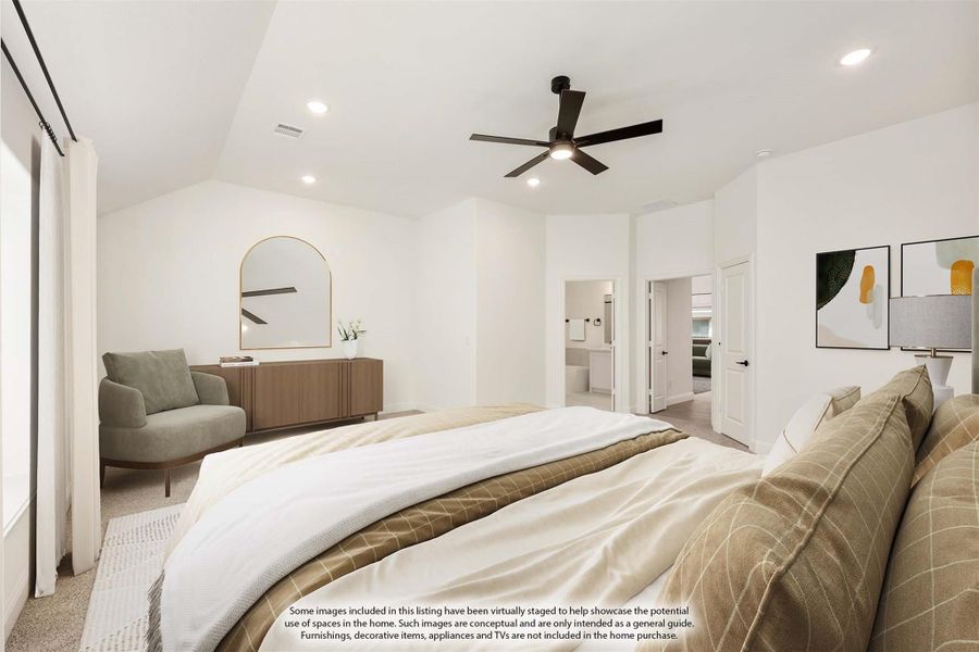 Master bedroom with vaulted ceiling, ceiling fan, and open ensuite bathroom door