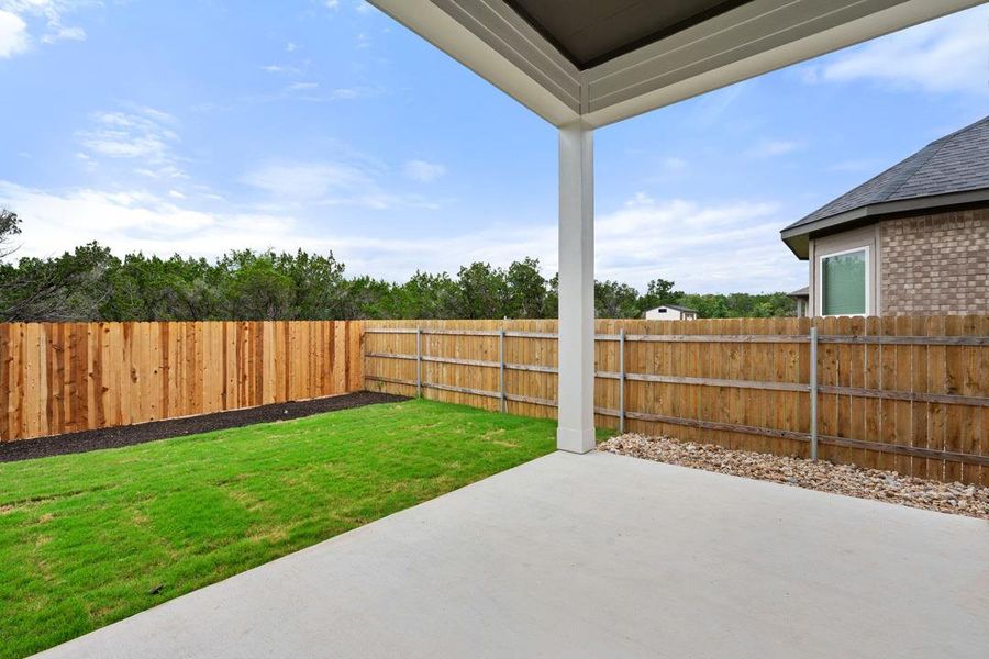 Exterior details and patio area of a home in Heritage, Dripping Springs (Image 22).