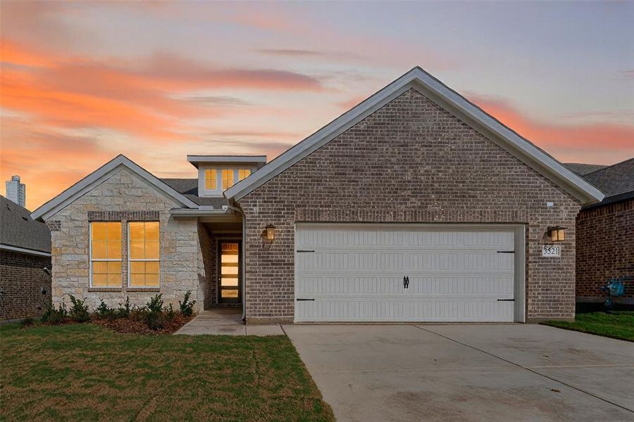 Front exterior of a new home in Liberty Pointe, Gainesville, TX, highlighting curb appeal (Image 1).