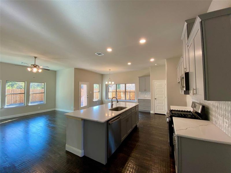 Kitchen with stainless steel gas GE appliances