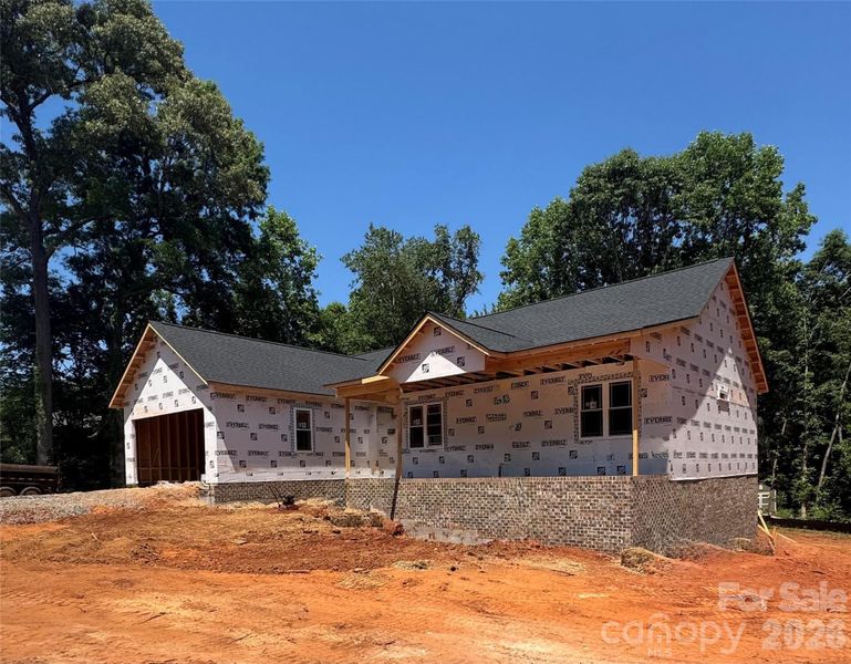 Front view of home. The front area will be brick including the garage front
