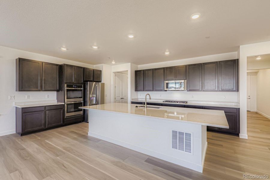Furnished interior view inside a new home in Sunset Village: The Grand Collection, Erie (Image 4). Furnished interior view inside a new home in Sunset Village: The Grand Collection, Erie (Image 4).