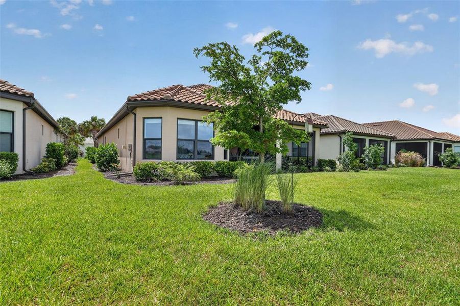 Front exterior of a new home in Skye Ranch Community Group Page, Sarasota, FL, highlighting curb appeal (Image 2). Front exterior of a new home in Skye Ranch Community Group Page, Sarasota, FL, highlighting curb appeal (Image 2).