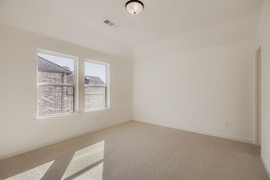 Unfurnished room with light carpet and baseboards