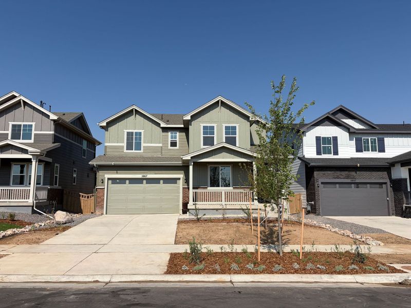 Front exterior of a new home in Painted Prairie, Aurora, CO, highlighting curb appeal (Image 1). Front exterior of a new home in Painted Prairie, Aurora, CO, highlighting curb appeal (Image 1).