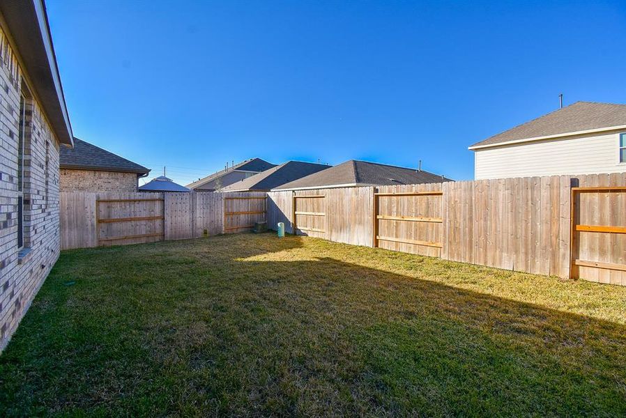 The entire back property is enclosed with sturdy privacy fencing.