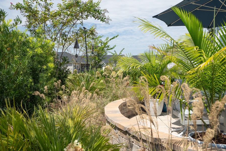 Front exterior of a new home in Horizons at Summers Corner | 55+: The Estates, Summerville, SC, highlighting curb appeal (Image 22).