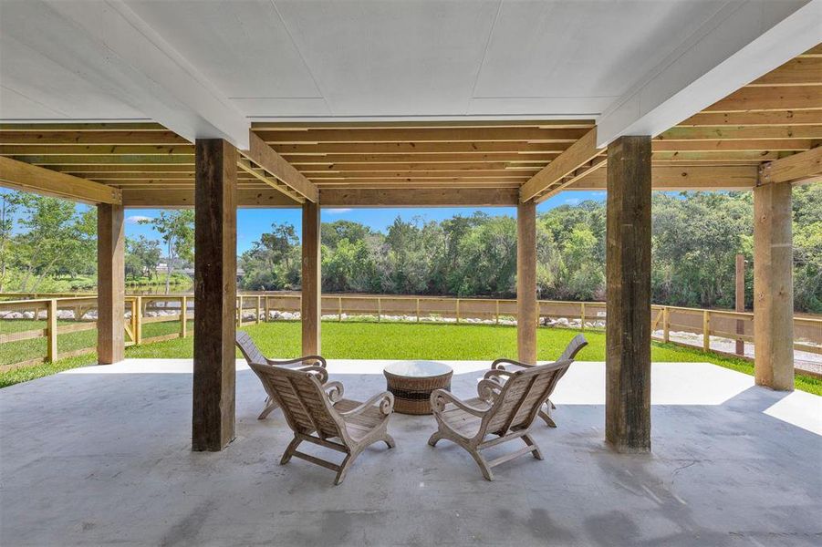 Relax under the extended covered awning from the garage, giving your backyard extra entertainment space.