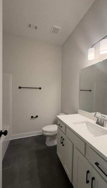Full bath with vanity and toilet