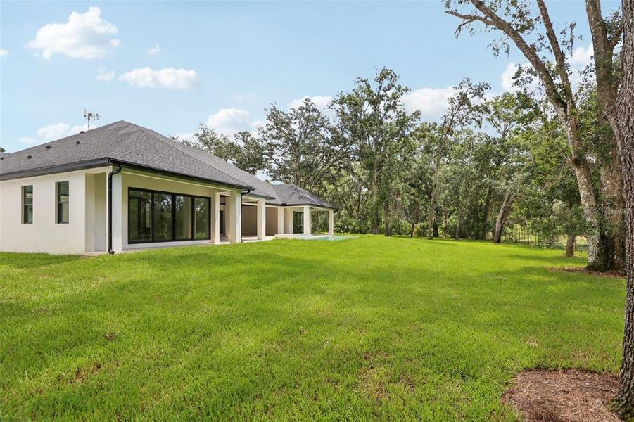 Front exterior of a new home in , Lutz, FL, highlighting curb appeal (Image 27).