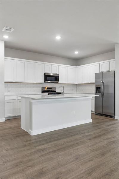 Kitchen in the Oscar home plan by Trophy Signature Homes – REPRESENTATIVE PHOTO