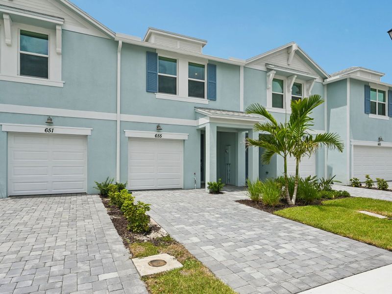 Front exterior of a new home in Tidewater, Fort Pierce, FL, highlighting curb appeal (Image 2). Front exterior of a new home in Tidewater, Fort Pierce, FL, highlighting curb appeal (Image 2).