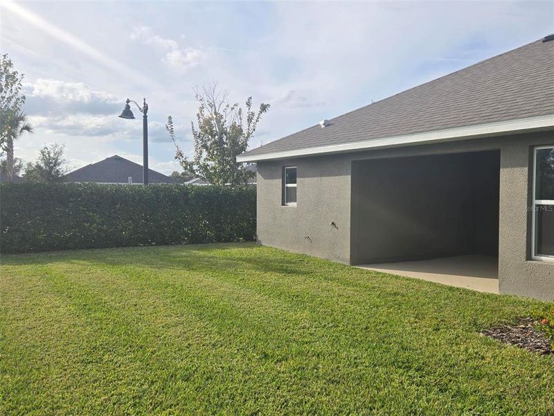 Exterior details and patio area of a home in Aviary at Rutland Ranch, Parrish (Image 18).
