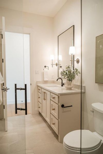 Full bath with vanity and light tile patterned floors Full bath with vanity and light tile patterned floors