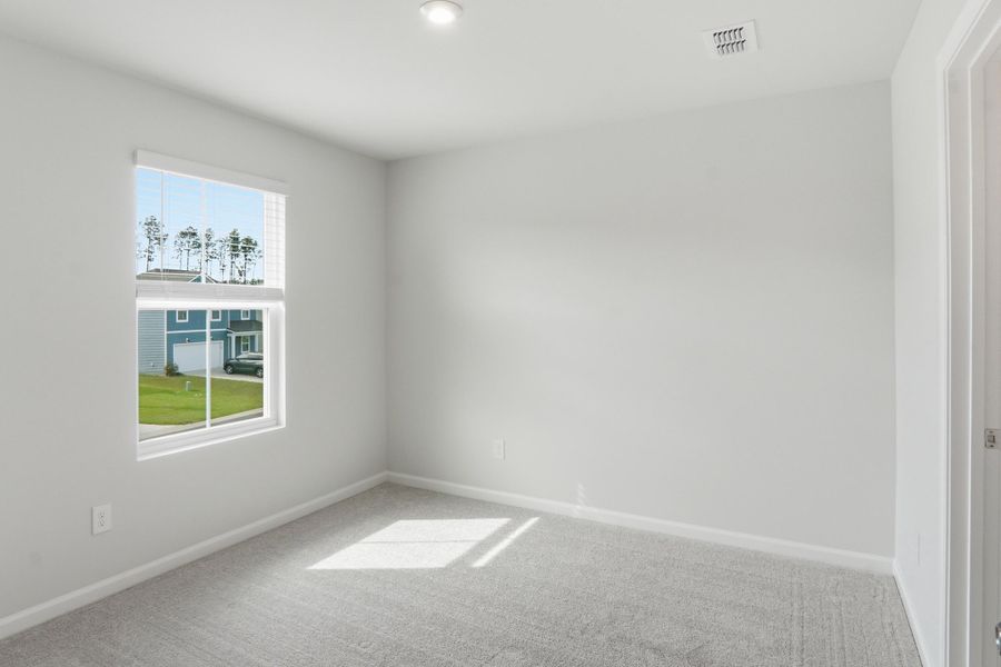 Spacious, unfurnished interior of a new home in Sanctuary Cove at Cane Bay, Summerville (Image 44).