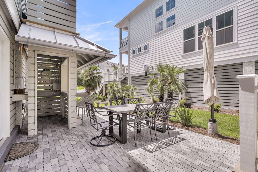 Exterior details and patio area of a home in Overlook at Copahee Sound, Awendaw (Image 35).