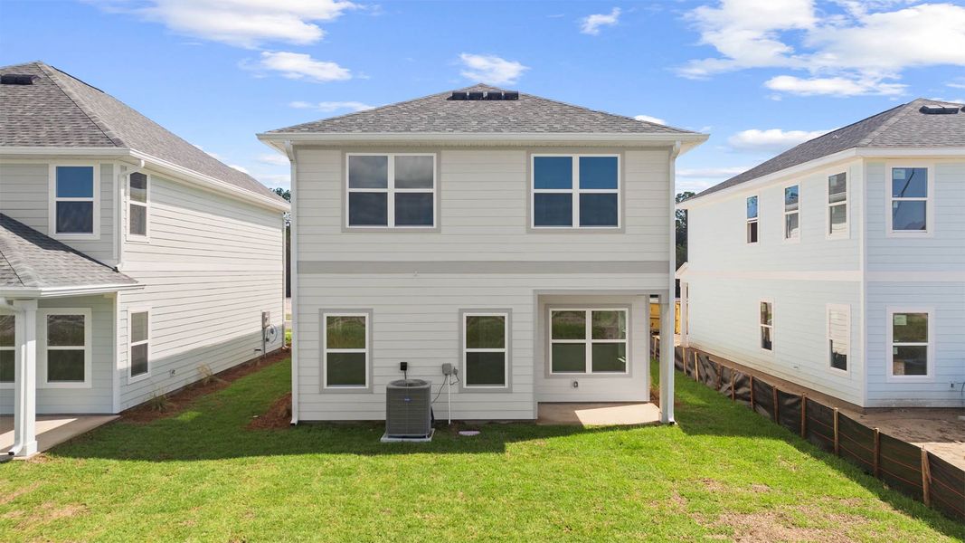 Exterior details and patio area of a home in Colonial East, Panama City Beach (Image 2).