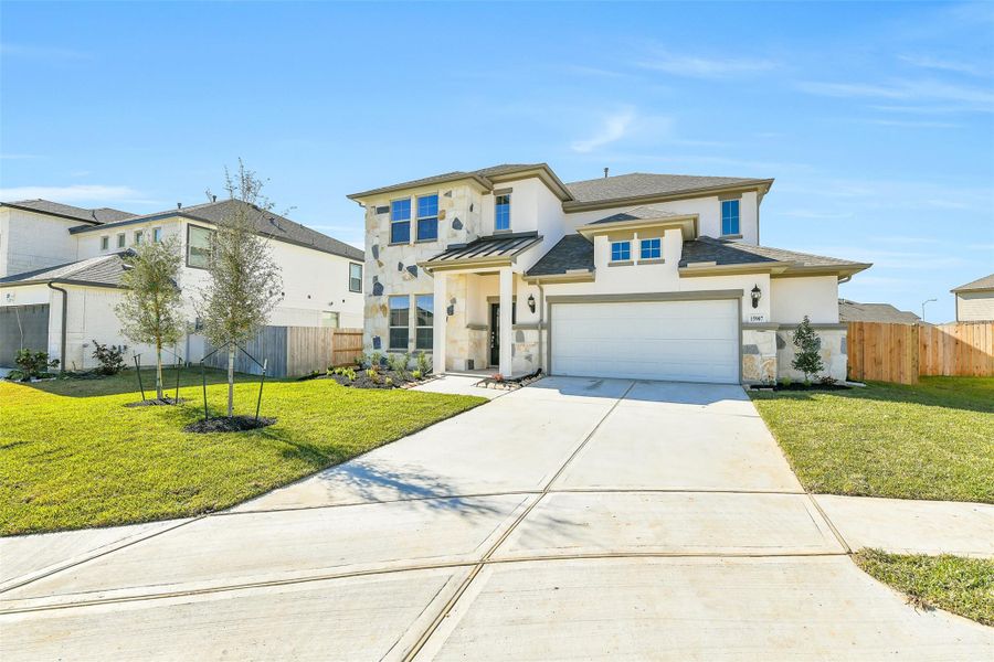 Front exterior of a new home in Stone Creek Ranch, Hockley, TX, highlighting curb appeal (Image 2).