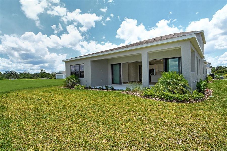 Front exterior of a new home in Canoe Creek, Parrish, FL, highlighting curb appeal (Image 28).
