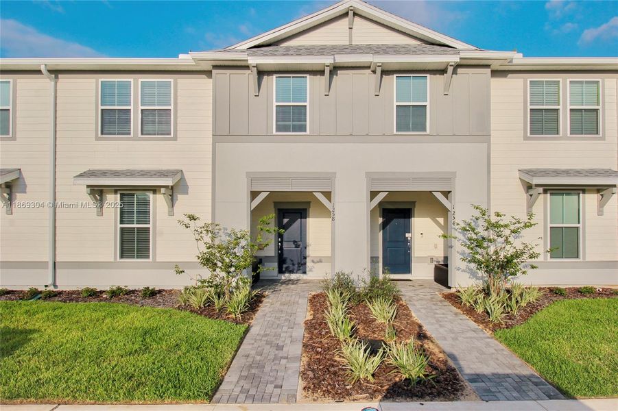 Front exterior of a new home in , Clermont, FL, highlighting curb appeal (Image 1).