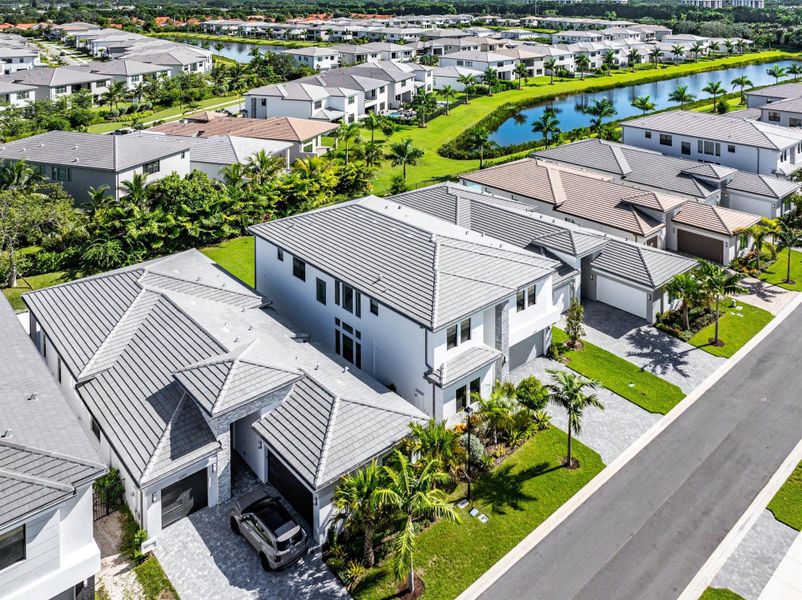 Front exterior of a new home in Lotus Edge, Boca Raton, FL, highlighting curb appeal (Image 29).