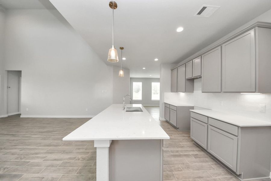 Welcome to a dream kitchen that exceeds expectations! Sample photo of completed home with similar floor plan. Actual colors and selections may vary. Welcome to a dream kitchen that exceeds expectations! Sample photo of completed home with similar floor plan. Actual colors and selections may vary.