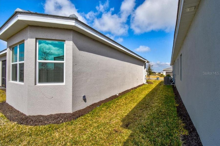 Exterior details and patio area of a home in Harbor East, Port Charlotte (Image 20).