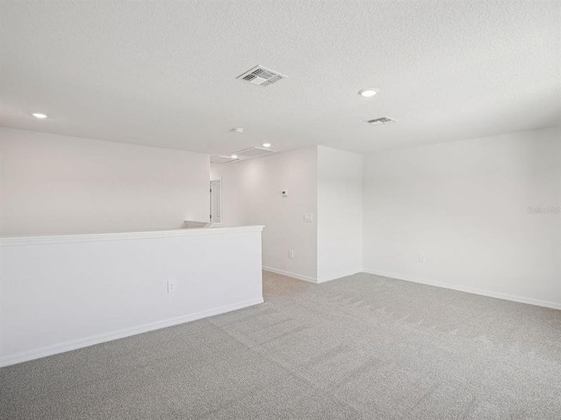 Spacious, unfurnished interior of a new home in The Grove at Stuart Crossing - Classic Series, Bartow (Image 33).