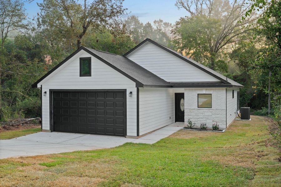 Front exterior of a new home in , Willis, TX, highlighting curb appeal (Image 2). Front exterior of a new home in , Willis, TX, highlighting curb appeal (Image 2).
