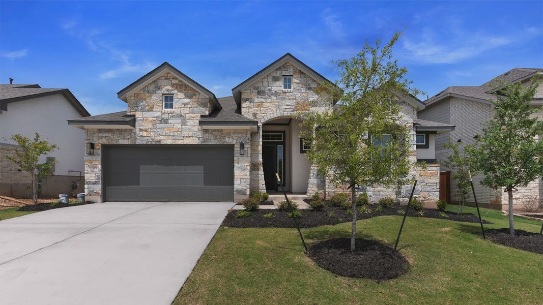 Representative exterior photo of a completed home built from the Michelle by Chesmar Homes in Newhaven, Manor, TX (Image 1). Representative exterior photo of a completed home built from the Michelle by Chesmar Homes in Newhaven, Manor, TX (Image 1).