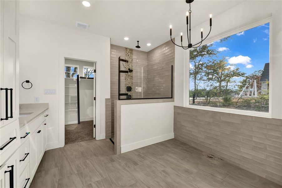 Unfurnished dining area featuring a chandelier and recessed lighting Unfurnished dining area featuring a chandelier and recessed lighting