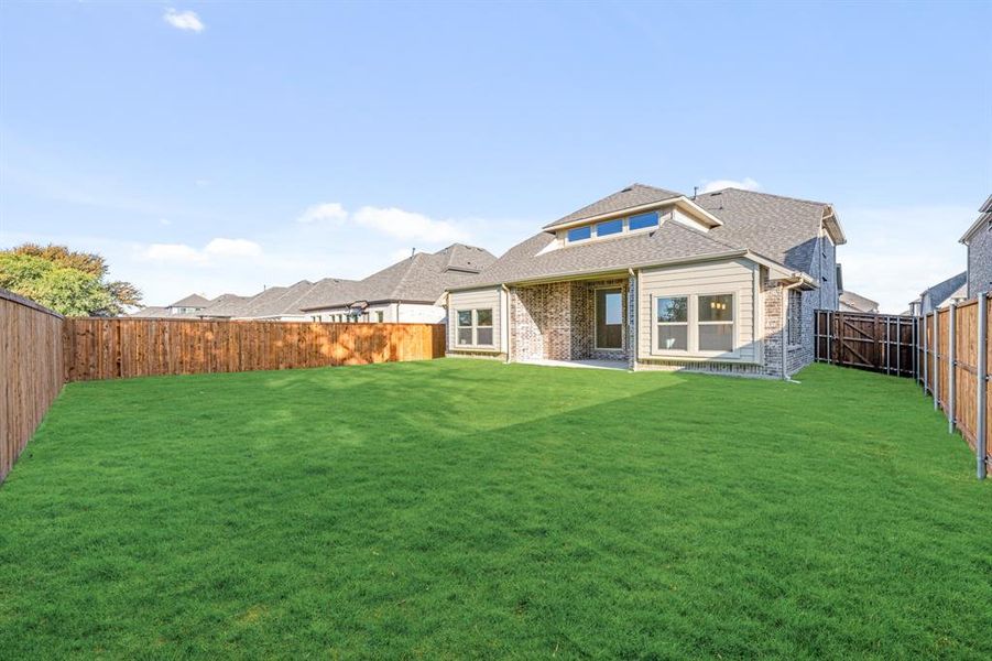 Exterior details and patio area of a home in Woodstone, Providence Village (Image 4). Exterior details and patio area of a home in Woodstone, Providence Village (Image 4).