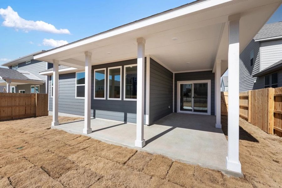 Exterior details and patio area of a home in Cannon Ranch, Dripping Springs (Image 25).