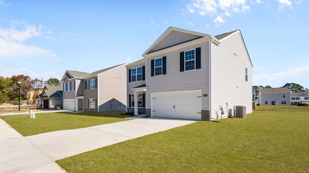 Front exterior of a new home in Madeline Farm, New Bern, NC, highlighting curb appeal (Image 16).