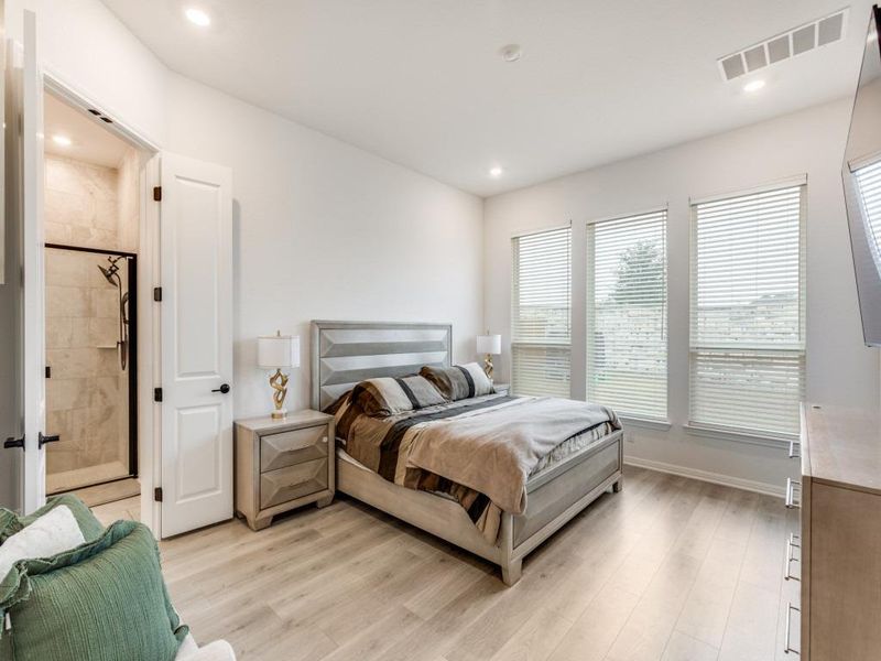 The primary suite is tucked at the back for privacy.