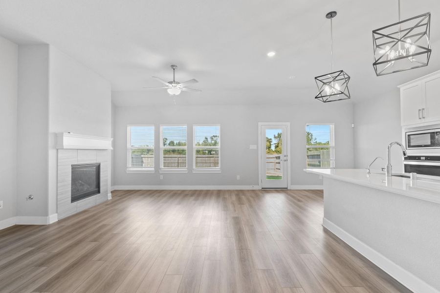 Living room, nook, and kitchen island. Living room, nook, and kitchen island.