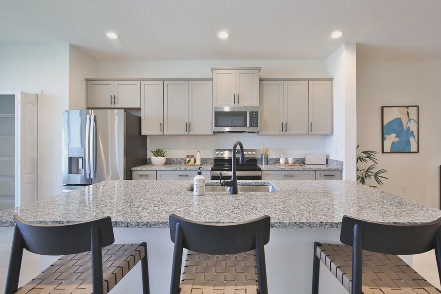 Representative furnished interior of a home built from the Morgan by Neal Communities in SkySail, Naples (Image 24).