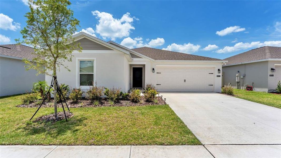 Front exterior of a new home in , Eagle Lake, FL, highlighting curb appeal (Image 1). Front exterior of a new home in , Eagle Lake, FL, highlighting curb appeal (Image 1).
