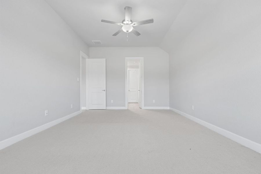 Primary bedroom view from bay window to primary bath and bedroom entry. Primary bedroom view from bay window to primary bath and bedroom entry.
