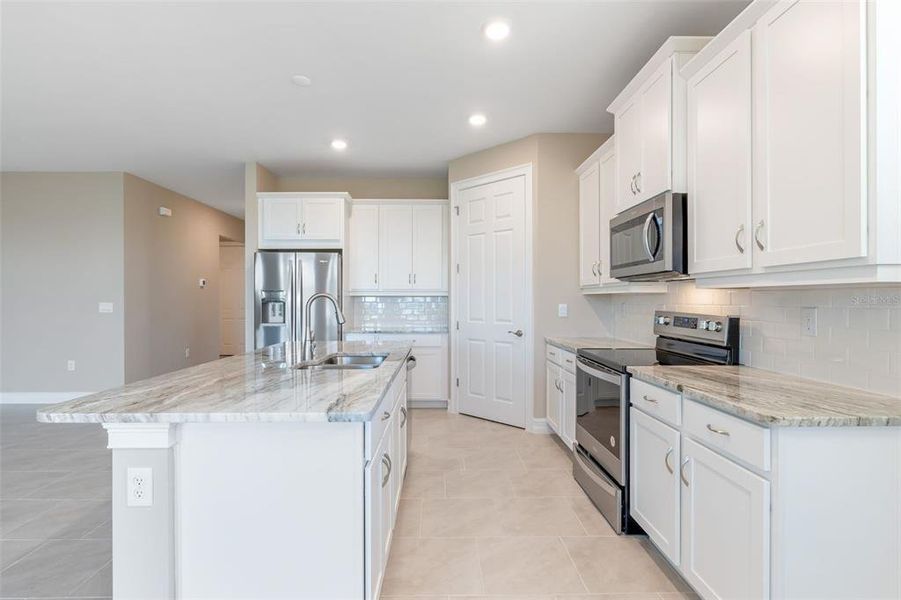 Furnished interior view inside a new home in Deep Creek Tradition Series, Punta Gorda (Image 9).