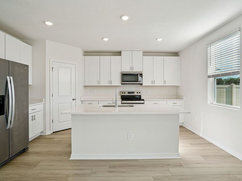 Furnished interior view inside a new home in Two Rivers - Classic Series, Zephyrhills (Image 5).