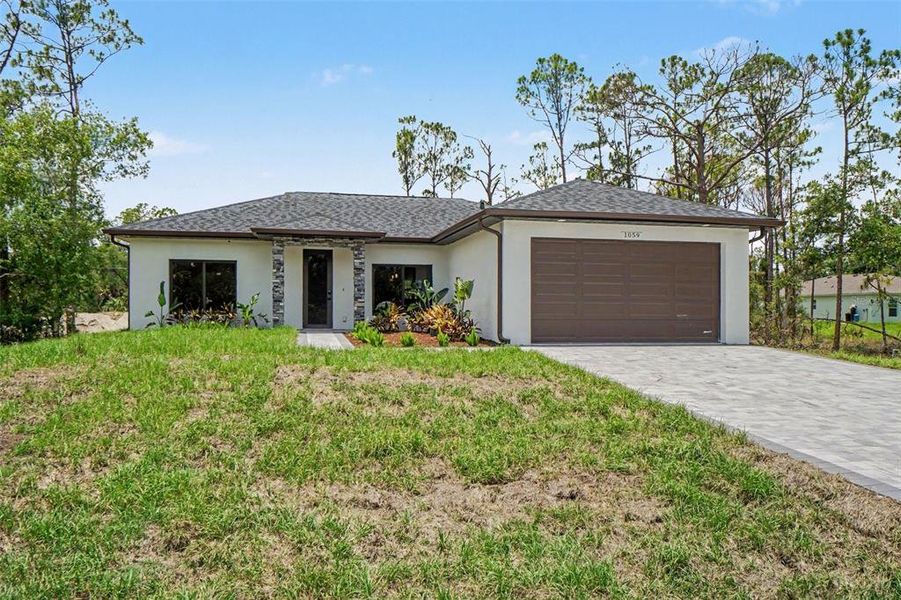 Front exterior of a new home in , Port Charlotte, FL, highlighting curb appeal (Image 25). Front exterior of a new home in , Port Charlotte, FL, highlighting curb appeal (Image 25).