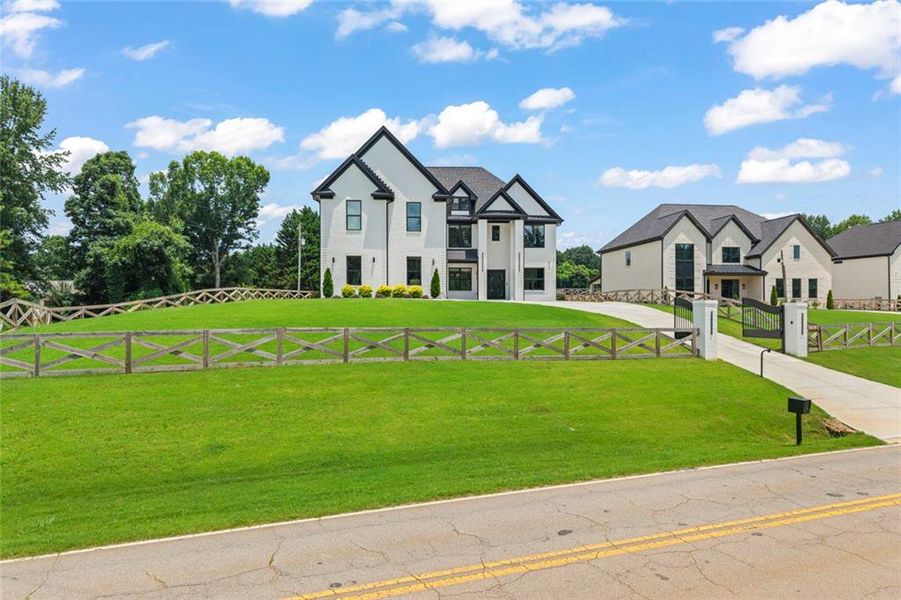 Front exterior of a new home in , Braselton, GA, highlighting curb appeal (Image 28). Front exterior of a new home in , Braselton, GA, highlighting curb appeal (Image 28).
