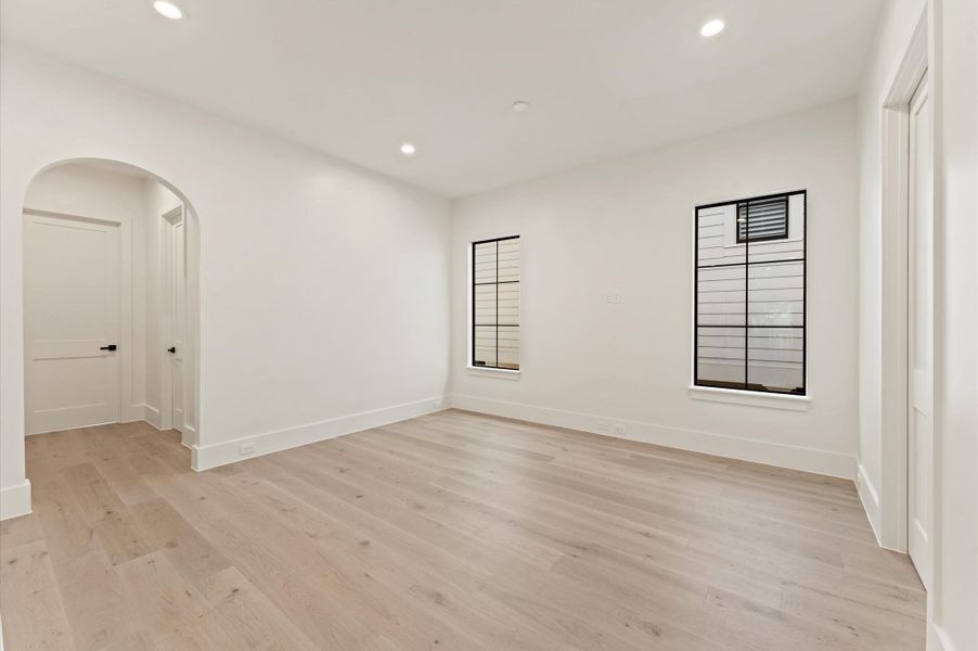 The second floor includes a large game room and bath with dual access. Striking arched doorway leads to two bedrooms with ensuite baths. The second floor includes a large game room and bath with dual access. Striking arched doorway leads to two bedrooms with ensuite baths.