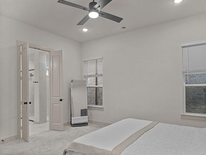 Master Bedroom featuring ceiling fan and light carpet