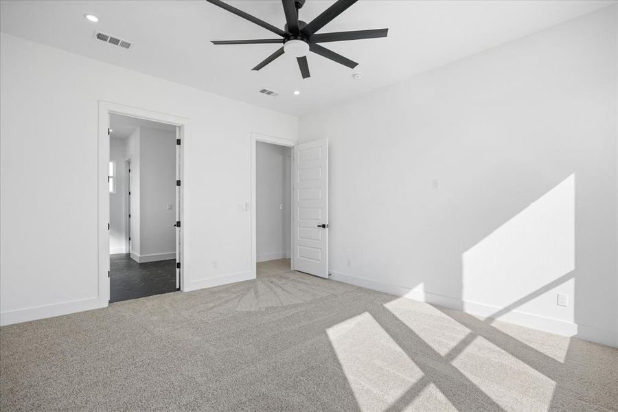 Master Bedroom featuring a modern black ceiling fan, recessed lighting, and white walls