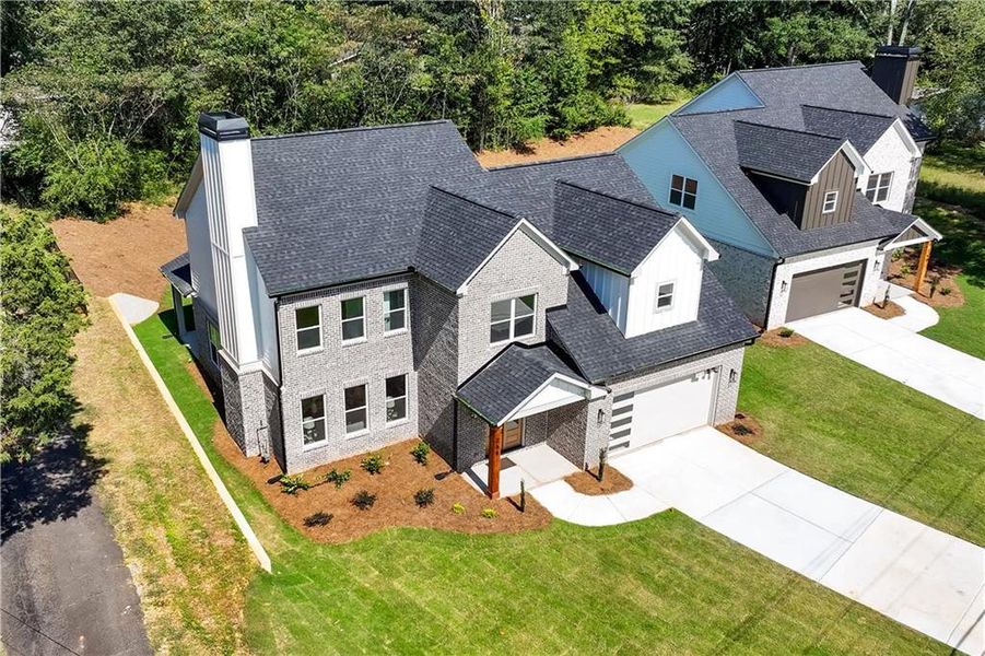 Front exterior of a new home in , Lawrenceville, GA, highlighting curb appeal (Image 29). Front exterior of a new home in , Lawrenceville, GA, highlighting curb appeal (Image 29).