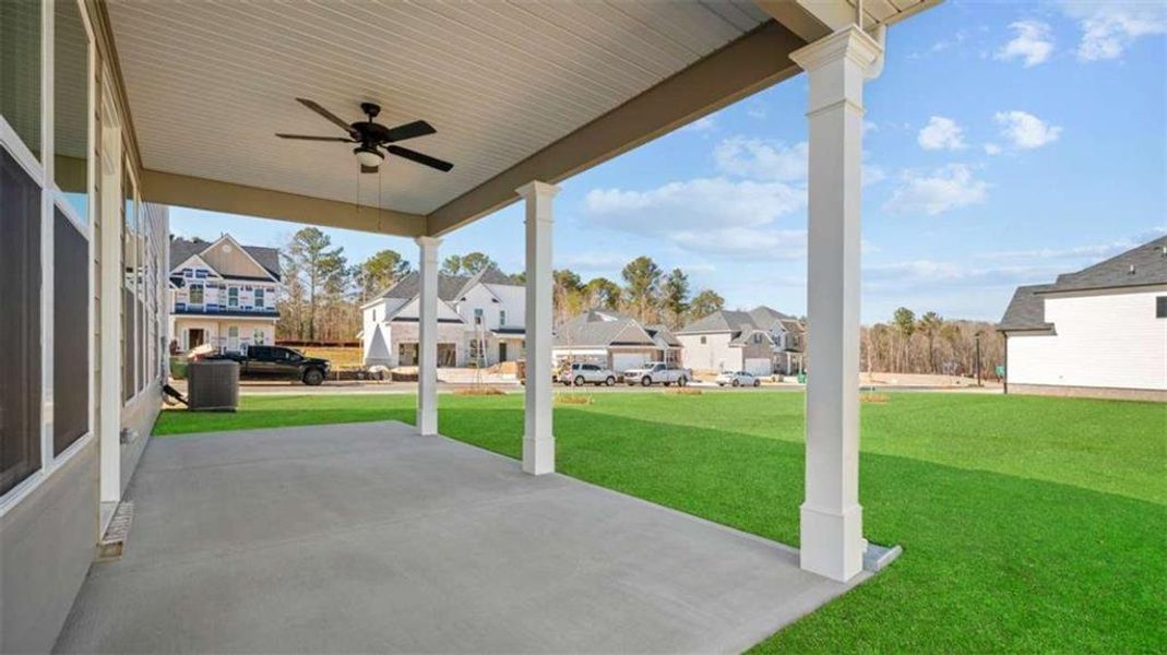 Exterior details and patio area of a home in Evergreen Crossing, Locust Grove (Image 2).